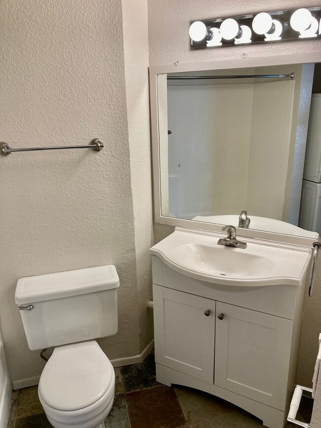 Building Photo - One Bedroom with Garage and IN-Unit laundry in Resort-Style Complex