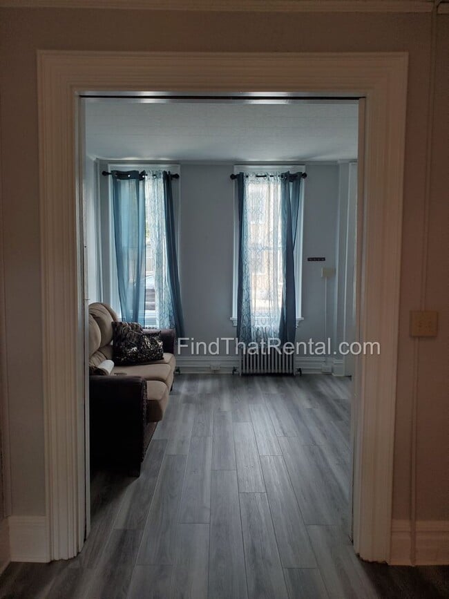 Building Photo - Charming Historic Retreat with Private Fenced Yard & Parking – Prime Downtown Location