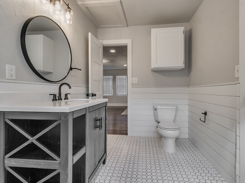 Guest bath opens to living area. - 1121 NW 43rd St