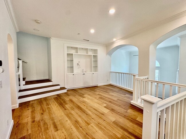 Building Photo - Beautifully Remodel Townhouse with AC & Two Car Garage!