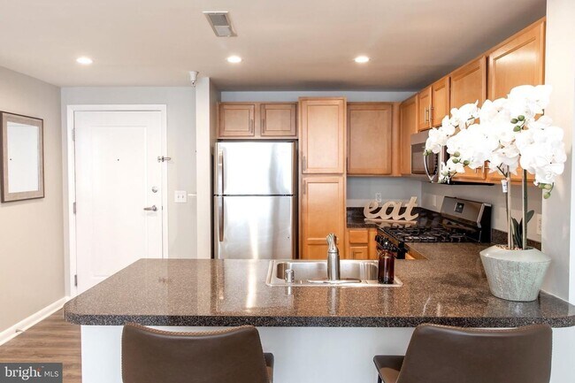 Building Photo - Bright 1BR with Parking Included, Minutes from The Wharf!