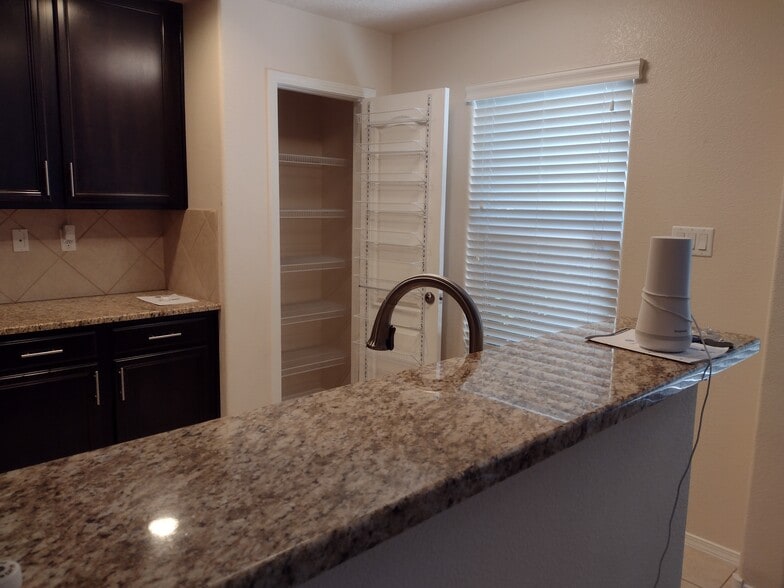 Divider between LR/DR and Kitchen, showing pantry - 10824 Arguello Trl NE