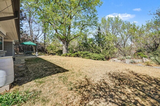 Building Photo - Sunlit Wheat Ridge Gem with Huge Wooded Backyard