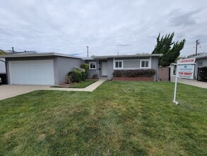 Building Photo - TURNKEY-RENT READY SPACIOUS 2BD/2BA HOME, 2-CAR GARAGE WITH AN AUTOMATIC ROLL-UP DOOR, LARGE COVE...