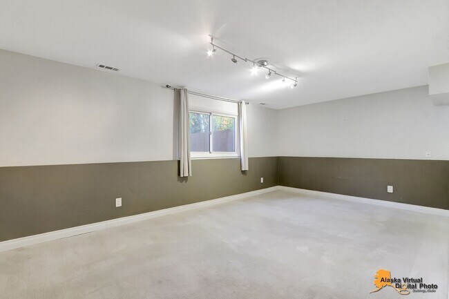 Building Photo - Eagle River Home w/ Fenced Yard, Sunroom, and Garage!