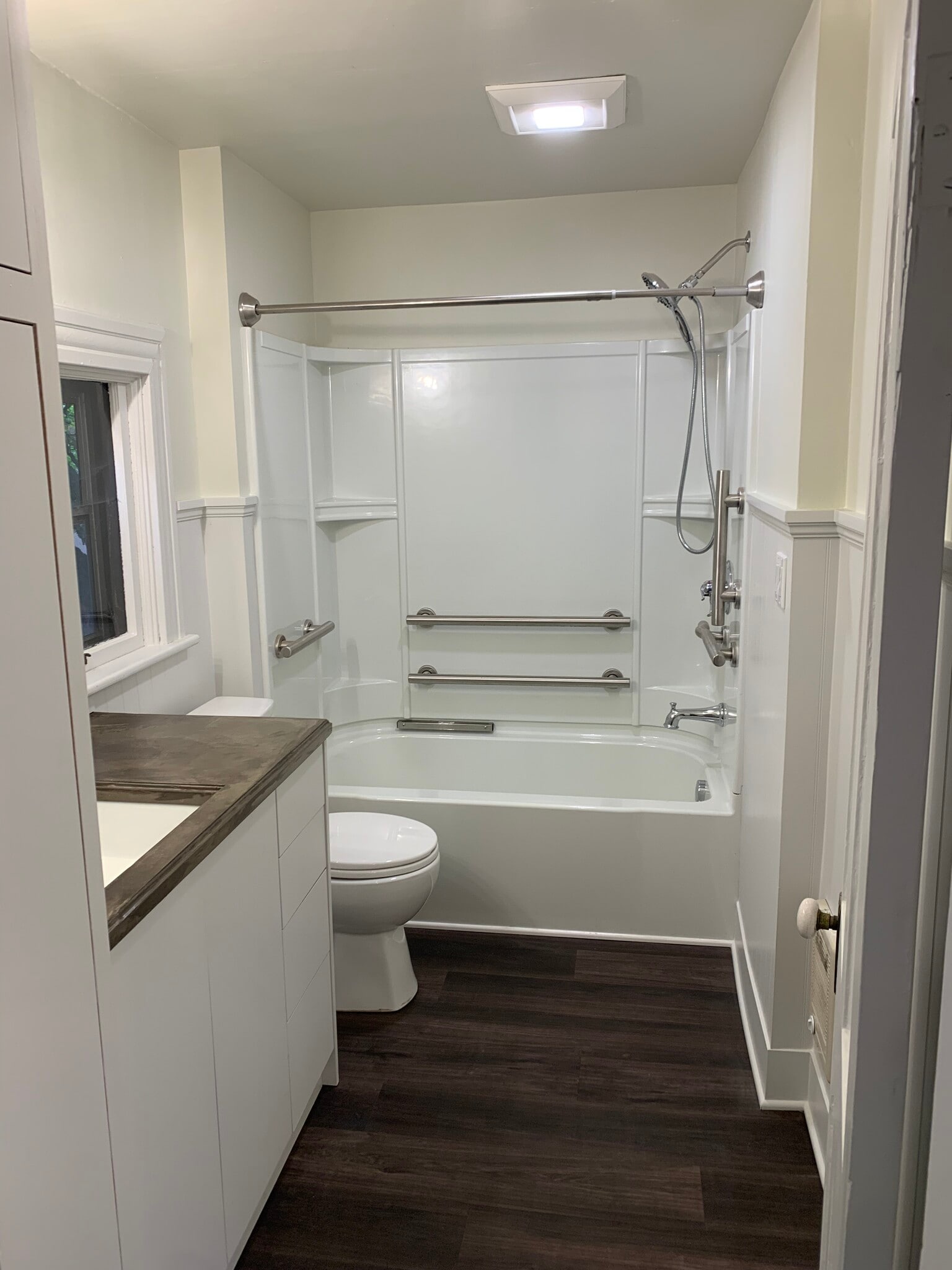 Main floor bathroom with lots of storage. - 1023 SE Bidwell St