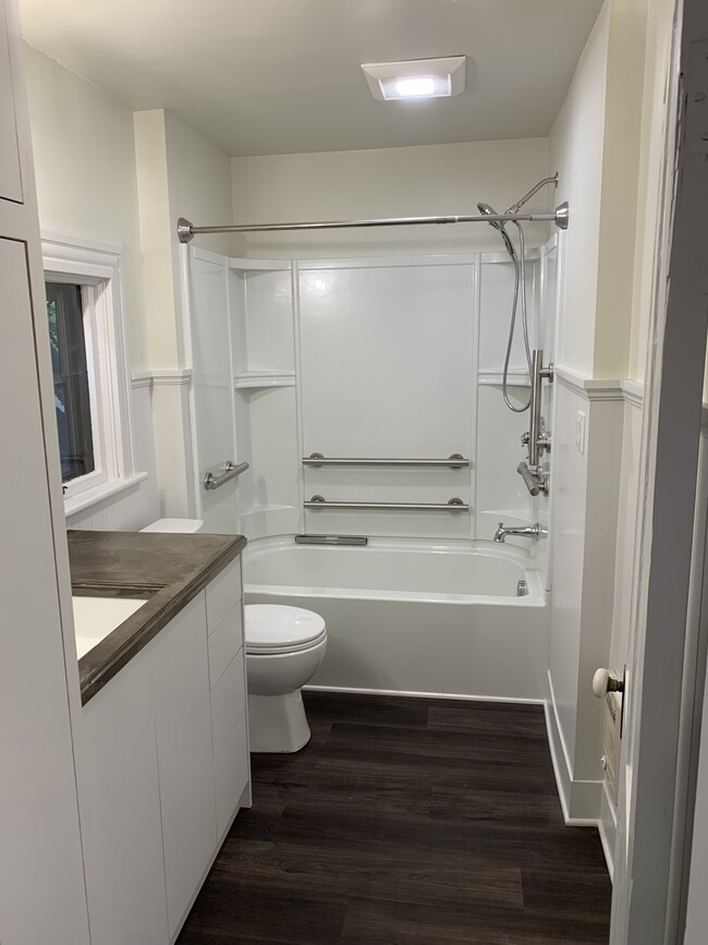 Main floor bathroom with lots of storage. - 1023 SE Bidwell St