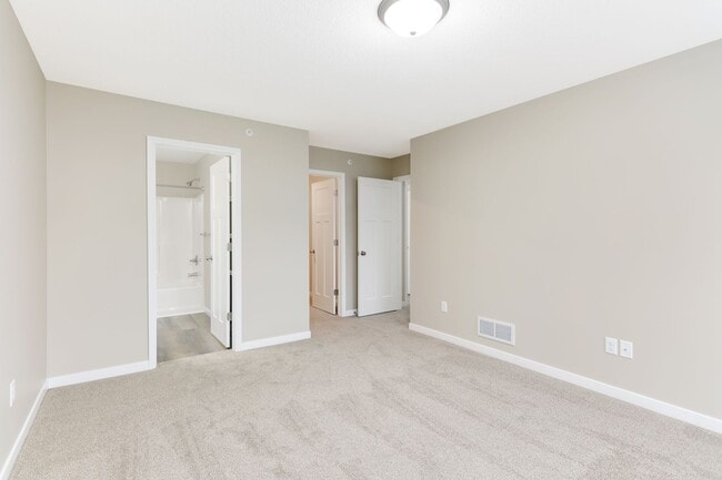 Building Photo - Otsego Townhome for RENT 3bd3ba2gar INTERIOR UNIT available May 01