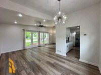 Building Photo - Spacious 4 Bedroom + Den Home with Private...