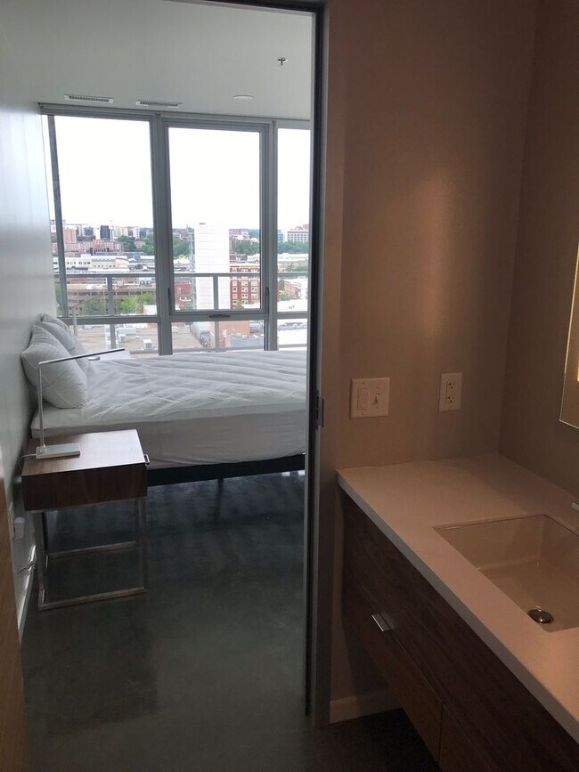 Building Photo - AVAILABLE SPRING 2027 - Downtown Iowa City High-Rise Condo with Amazing Views