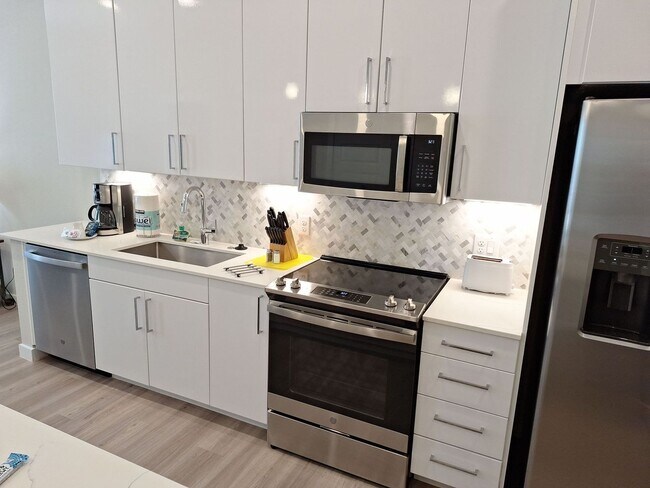 Building Photo - Your urban prairie sanctuary is here! One of a kind apartment homes where art, luxury & convenien...