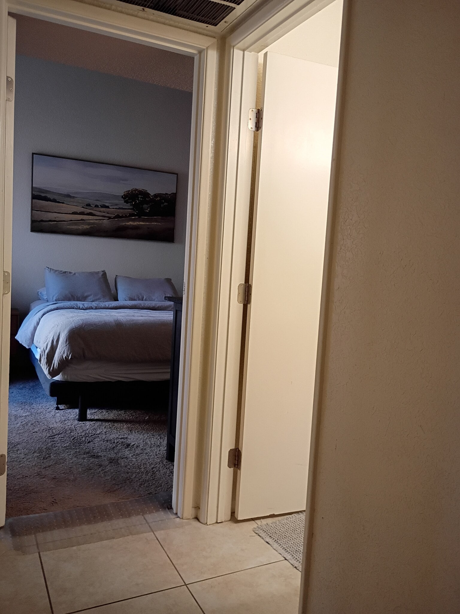 1st floor bedroom with first floor bath to the door on roght - 7618 E Callisto Cir