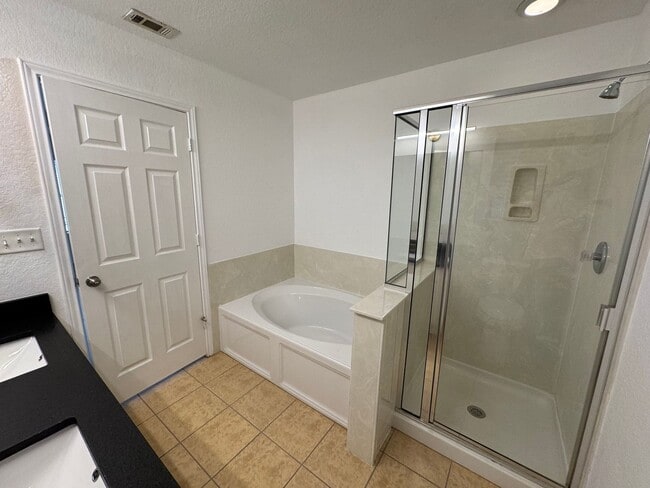 Building Photo - CUTE ONE STORY FEATURING WOOD STYLE VINYL PLANK FLOORING THROUGHOUT*XERISCAPING FOR LITTLE LAWN M...