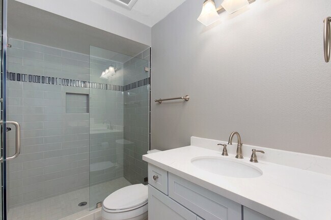 Building Photo - Lake and Golf Course View- Remodeled Condo w/ 2 Car Garage!