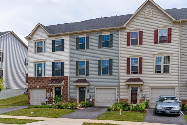 Building Photo - Townhouse with 1-Car Garage, Rooftop Deck ...