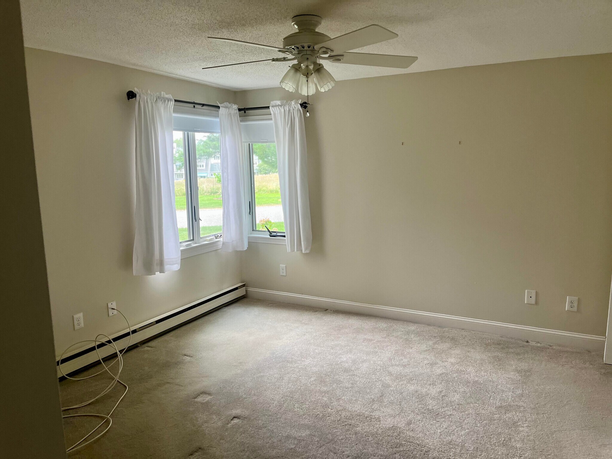 Bedroom #1, with view of the wild meadow - 77 Windward Ln