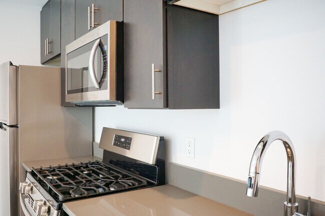 Building Photo - Modern & Sleek One-Bedroom Townhouse Ready...