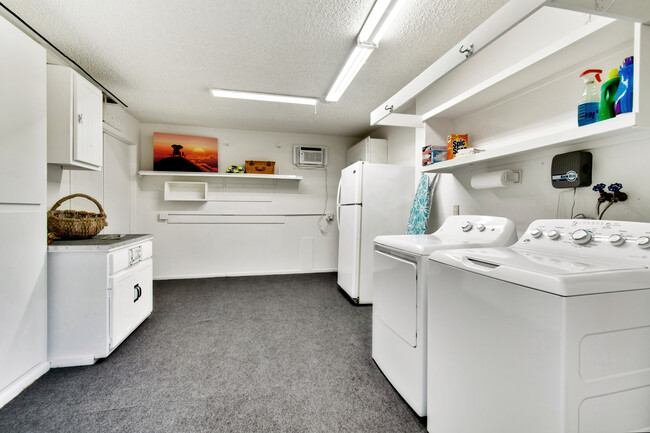 Spacious utility room with new washer and dryer, and plenty of room for a Man Cave/She Shack or hobby space - with tons of storage! - 12414 W Nugget Ct