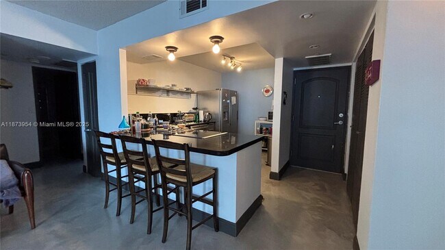 Building Photo - 3675 N Country Club Dr