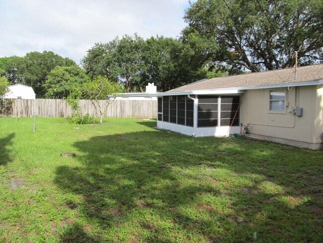 Building Photo - Three bedroom one and a half bathroom house with large yard space