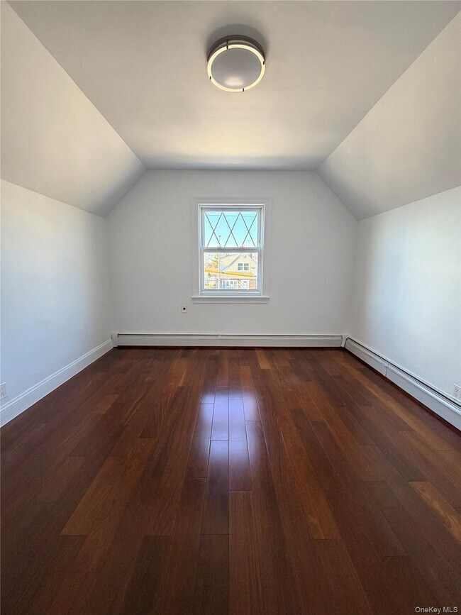 Building Photo - 210-10 56th Ave