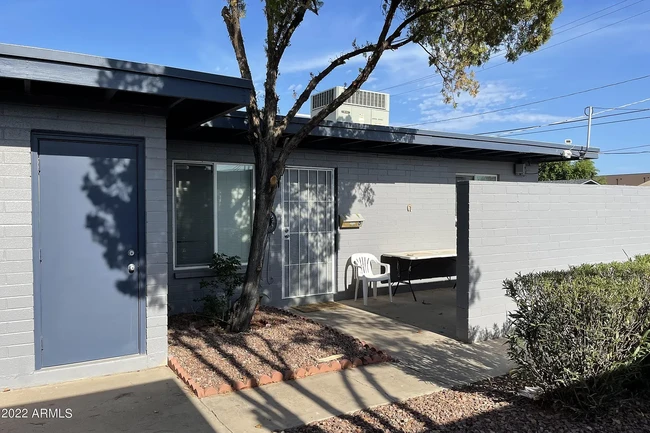 Front door and outdoor storage - 1078 W Flint St