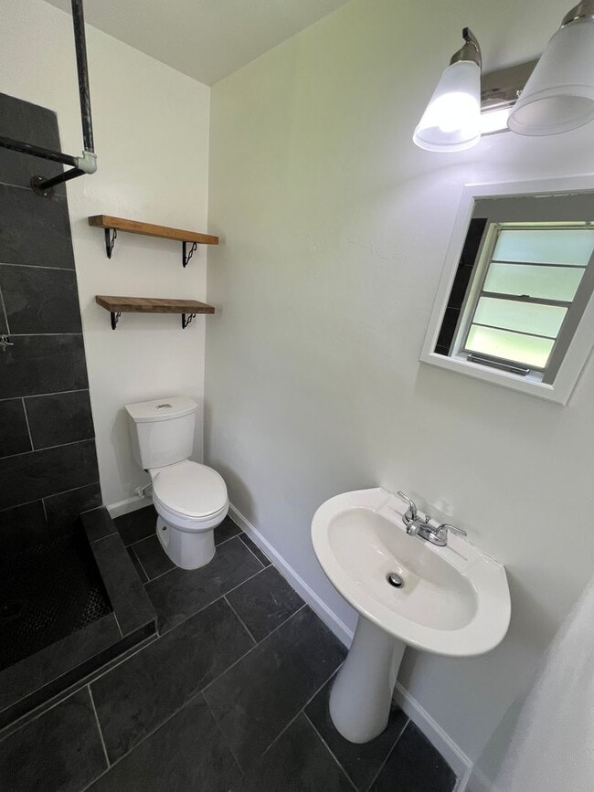 Building Photo - Updated 3BR | Solar Panels + Fenced Yard