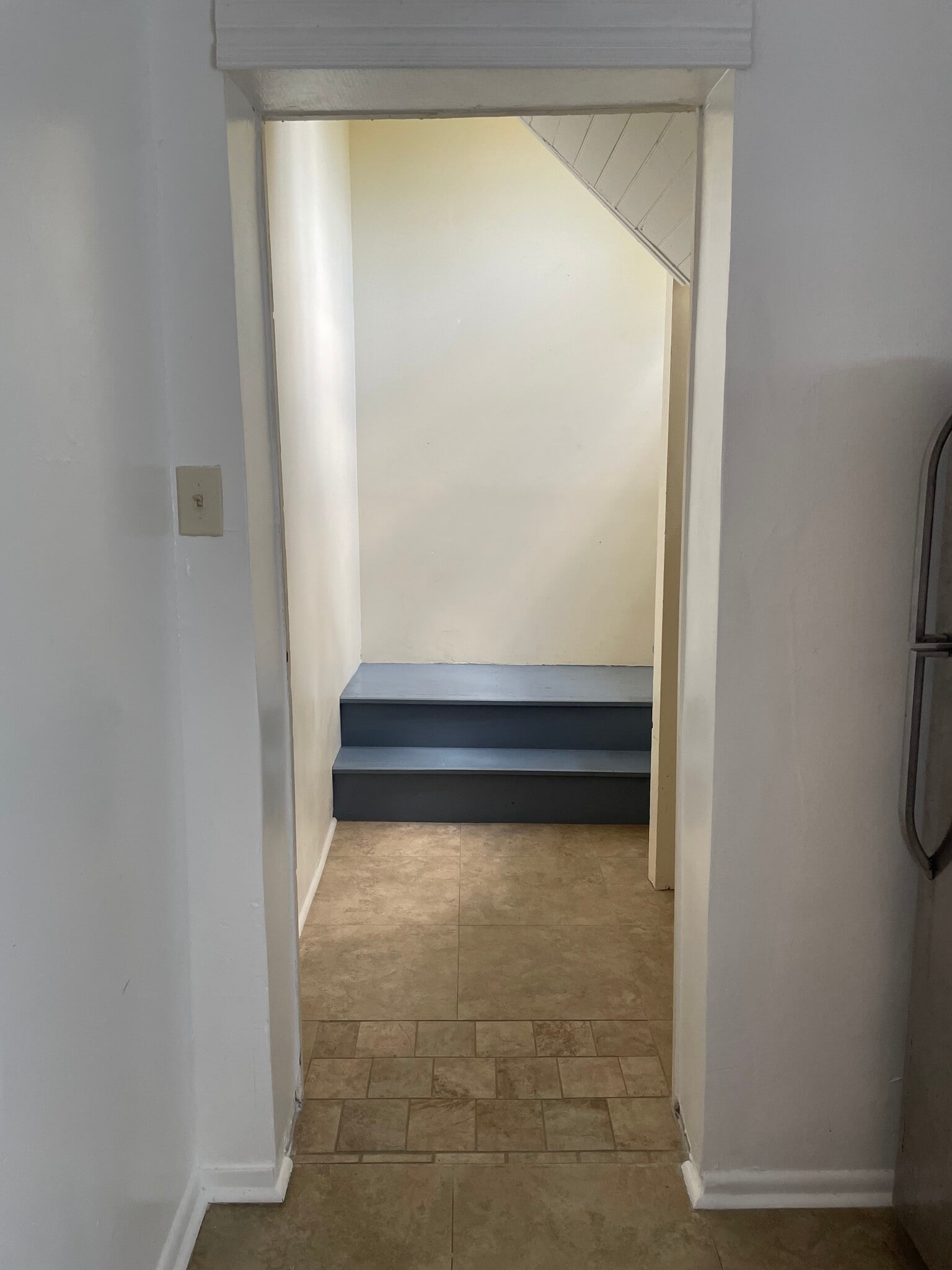 Stairway to the second floor with refrigerator on the left. - 1230 Mandeville St