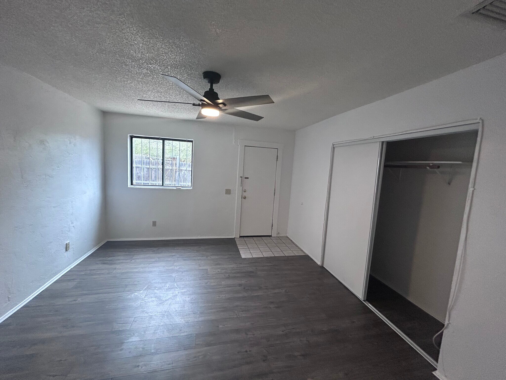 Bedroom with new remote control fans - 616 E 8th St