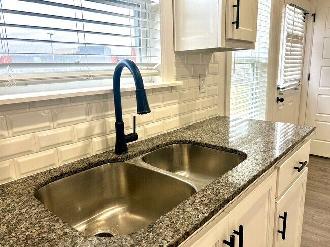 Building Photo - Centerton Home Available NOW! 4 bed, 2 full bath no carpet home. LARGE fenced backyard