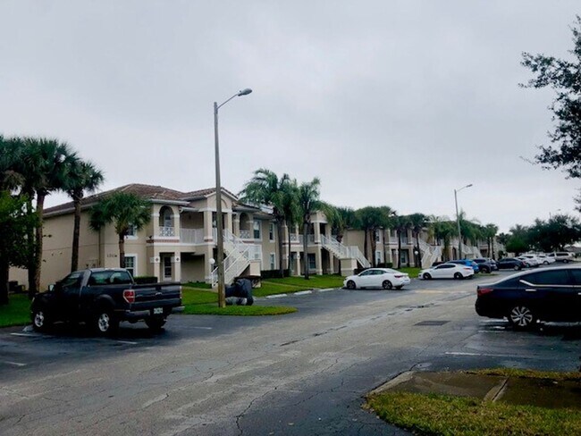 Building Photo - Nice 2X2 located on 2nd floor- Tile & lami...