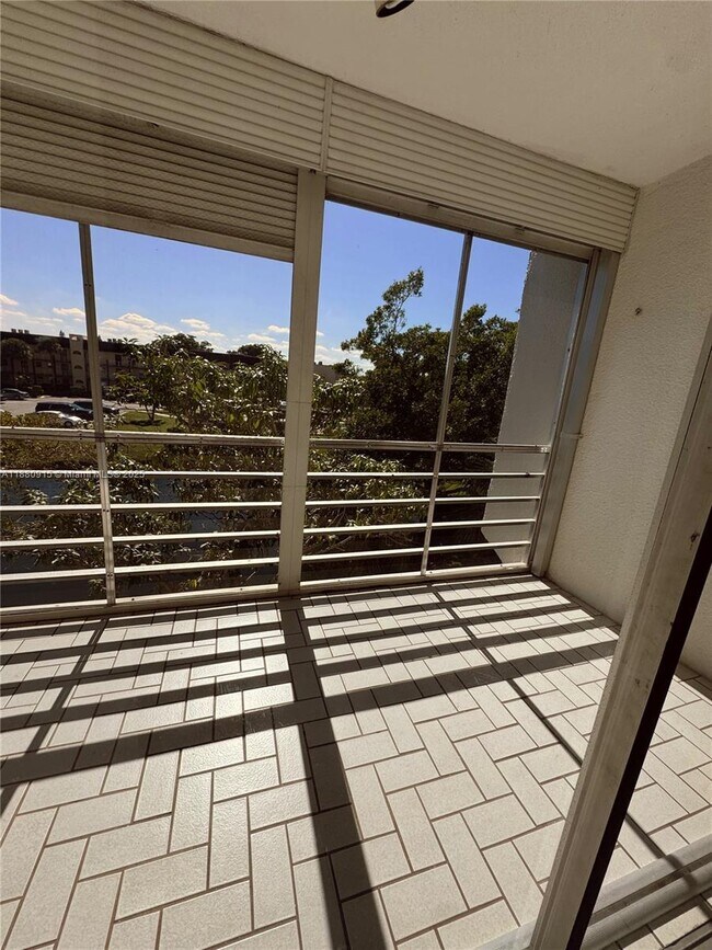 Building Photo - 8595 Sunrise Lakes Blvd