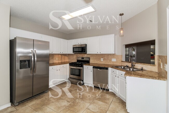 Building Photo - Prepare to fall in love with this 4BR, 2.5BA home.