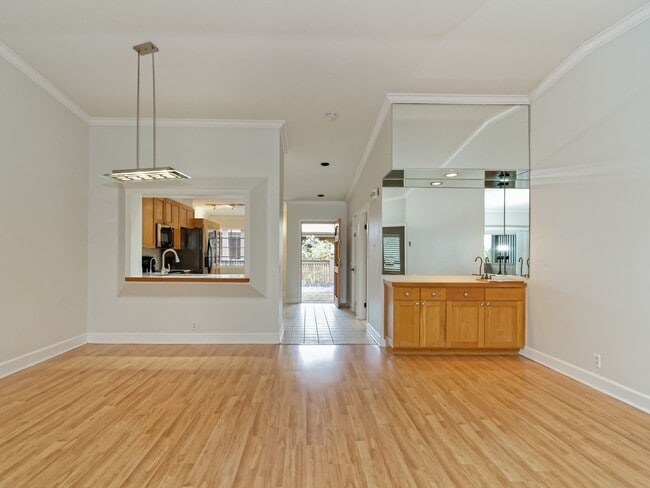 Building Photo - Water, Sewer, Trash Included! Fireplace, Washer, Dryer, 2 Assigned Parking, Garage, Open Floor Pl...