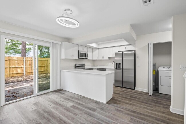 Building Photo - "Charming 2-Bedroom Townhouse Retreat with...