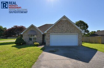 Building Photo - All brick 3bd 2ba home w/ attached garage on a corner lot!
