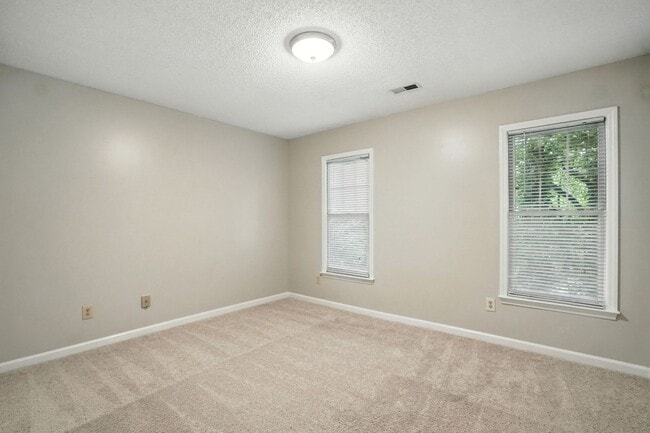 Building Photo - Spacious 2-Bedroom, 2.5-Bath End-Unit Town...