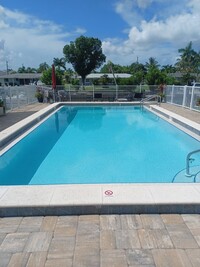 Building Photo - UPGRADED WATERFRONT END UNIT 3 BR / 2 BA Home With BOAT LIFT/ DOCK & OUTSTANDING VIEWS