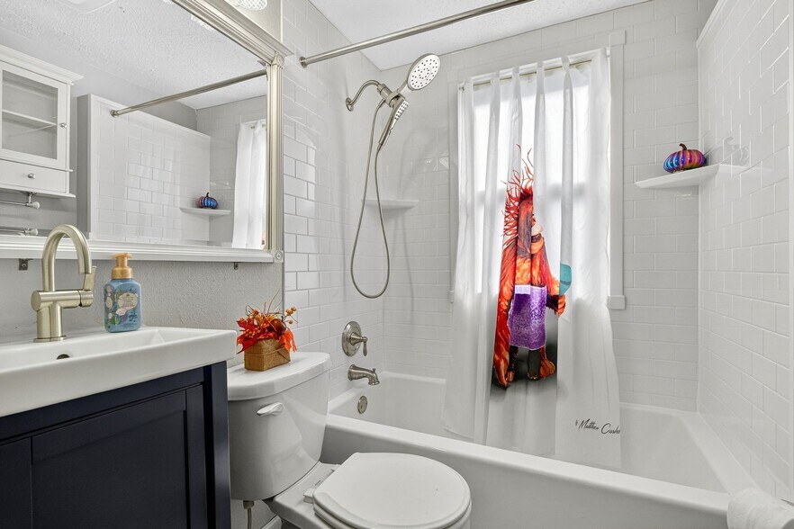 Main Floor Full Bathroom with Brand New Sink, Faucet, and Showerhead - 4429 S Hills Dr