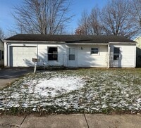 Building Photo - three bedroom one bath home with attached garage for rent