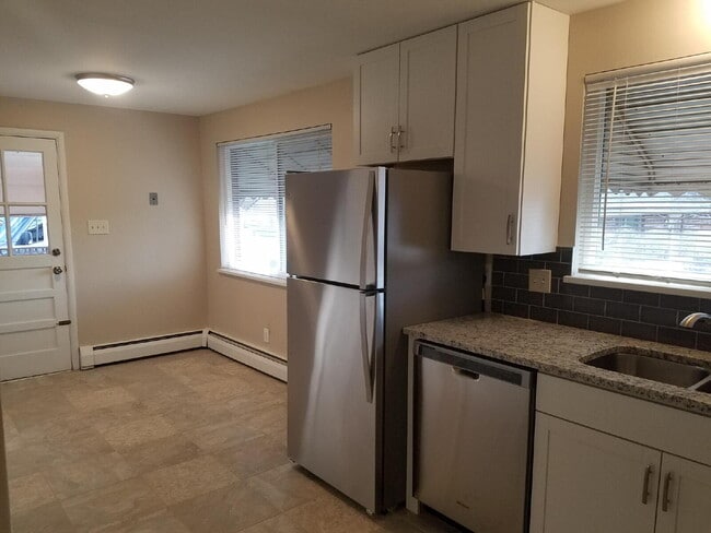 Building Photo - ***AVAILABLE NOW***  Spacious 4-Bedroom Wheat Ridge Home with Finished Garden Level and Two-Car G...