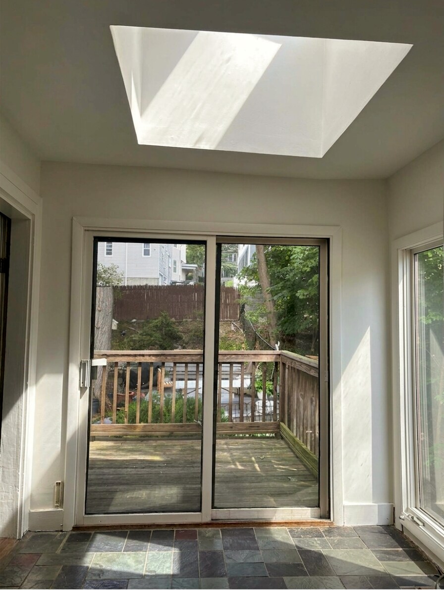 Sitting area as seen from kitchen. Seamlessly continues into a deck that overlooks the backyard - 307 Tappan St