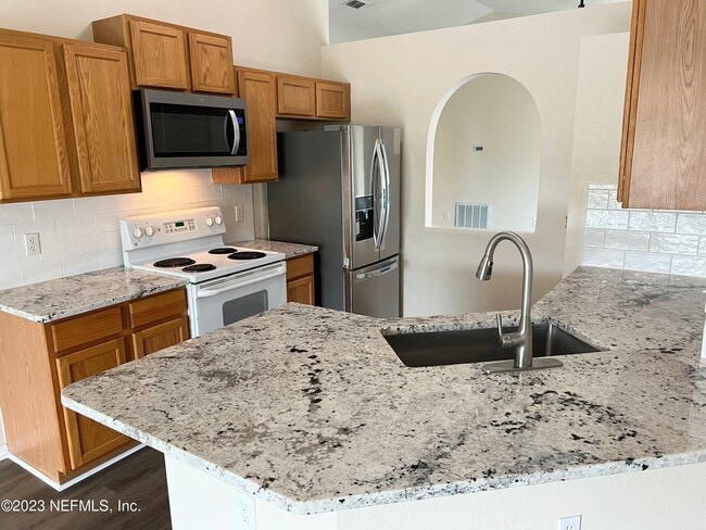 Building Photo - 6580 Gentle Oaks Dr N