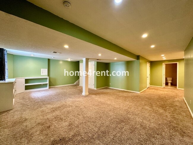 Building Photo - Beautiful Four-Bedroom Home with Three Car Garage, Wood Floors, Finished Basement and a Fenced Ya...