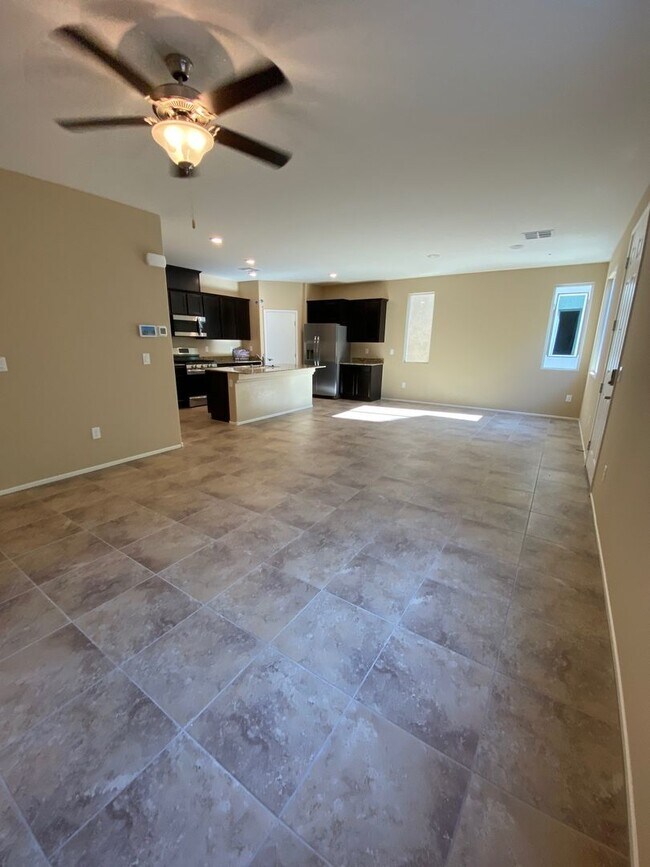 Building Photo - Spacious Townhouse with Loft & Rare 3-Car Garage!