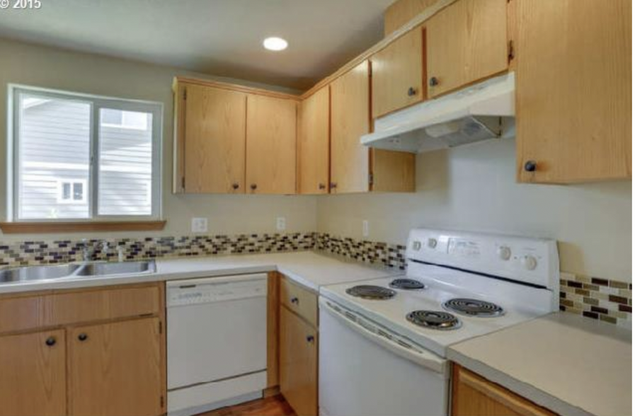 kitchen- now has stainless gas stove - 6925 SE 65th Ave