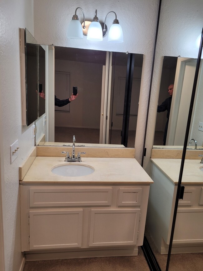 Bathroom Vanity area - sink, faucet, paint, carpet, and light fixtures - 2 yrs 4 mths old - 13006 Wimberly Sq