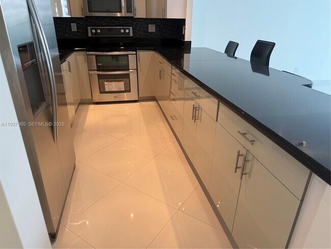 Building Photo - 19380 Collins Ave