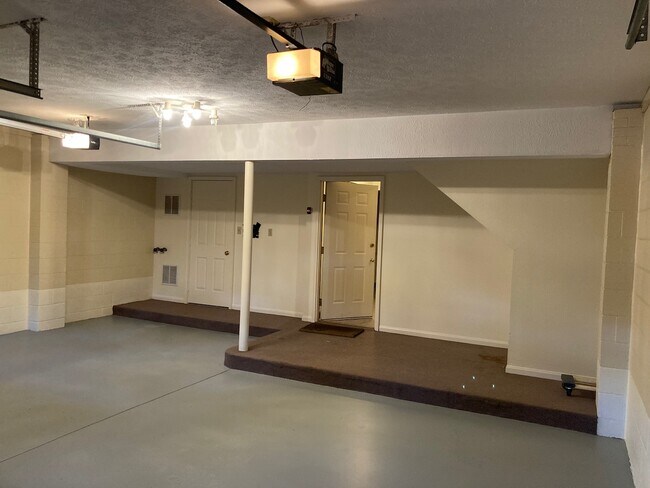 Garage showing area for storage and direct access inside - Juno Place Townhomes