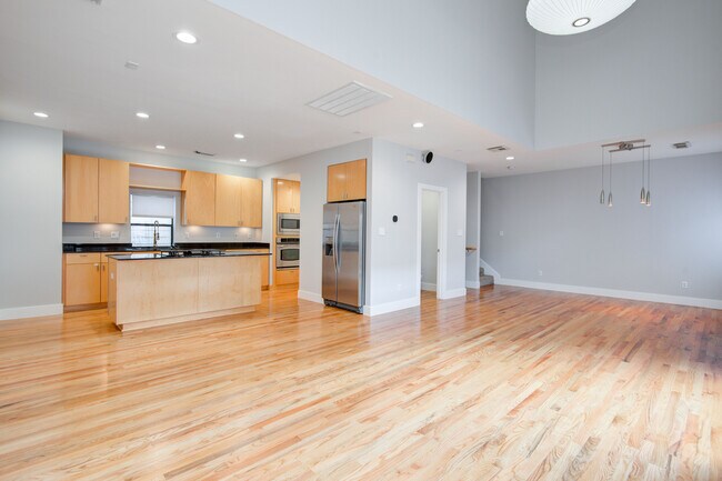 Another view of main floor with kitchen pictured. - 4202 Spencer St